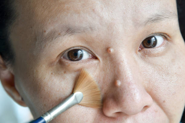 istock asian woman brush on her cheek face 689579592