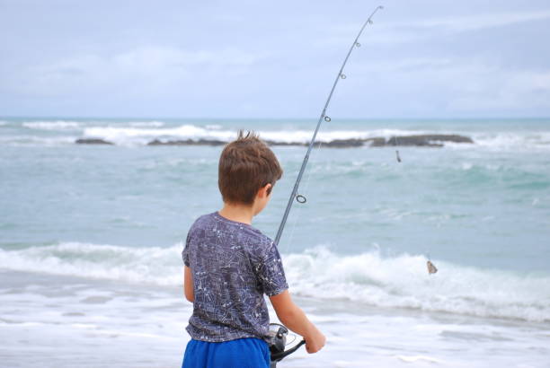 istock Boy Surf Fishing in Summer 689579712