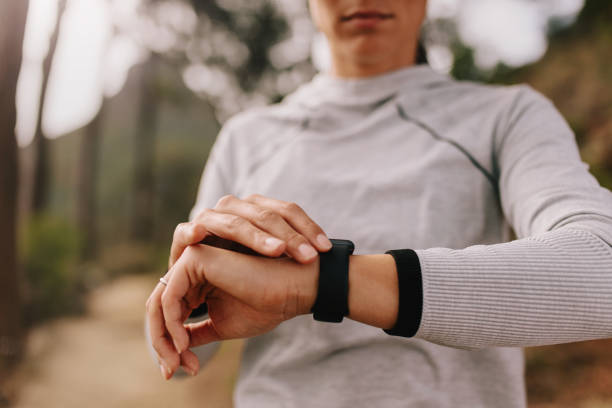istock Runner checking fitness progress on her smart watch 689582344