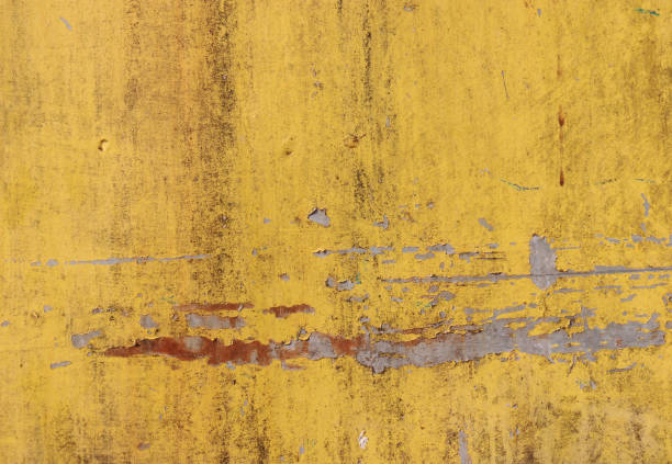 istock The flaking yellow color with scratched on the surface of rusty galvanized iron plate may be used as background 689583102
