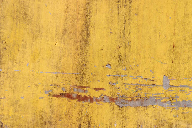 istock The flaking yellow color with scratched on the surface of rusty galvanized iron plate may be used as background 689583104