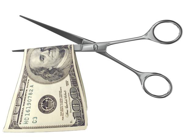 price money cut scissors - cheap finance cutting downsizing imagens e fotografias de stock
