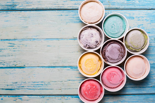 istock Top view Ice cream flavors in cup on wood background 689589466
