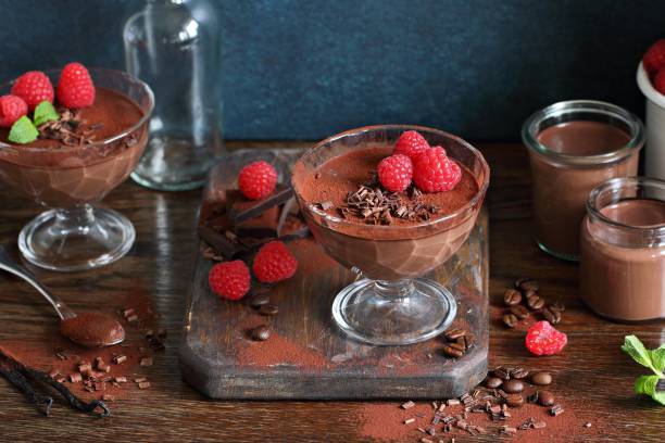 istock Chocolate dessert. Panna cotta, pudding or mousse with fresh raspberries. 689589938