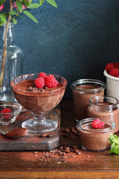istock Chocolate dessert. Panna cotta, pudding or mousse with fresh raspberries. 689590058