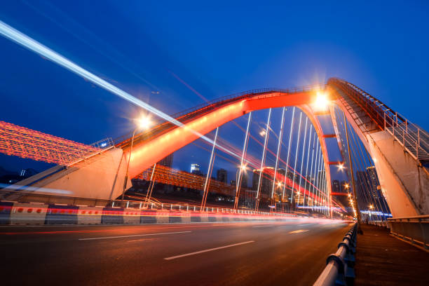 istock motion blurred traffic on bridge,chongqing china. 689593040