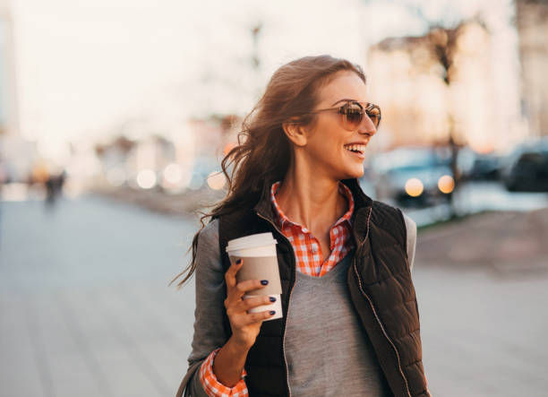 istock Woman drinking coffee outdoors. 689593184