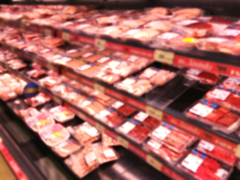Abstract blur background of supermarket with meat product shelf for shopping concepts