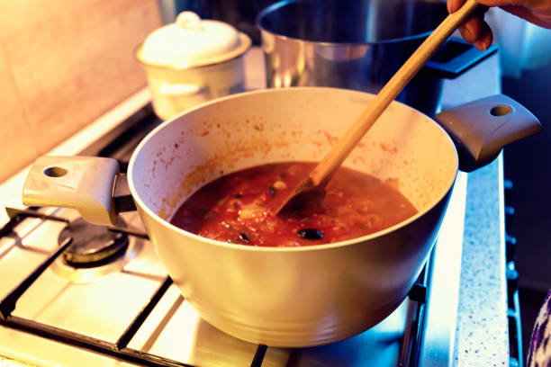 istock Cooking home-made pasta sauce on a gas stove 689596140