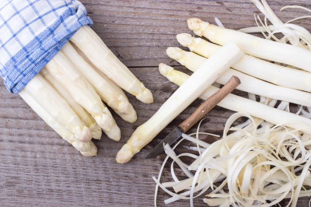 istock White asparagus is peeled with a knife 689596218