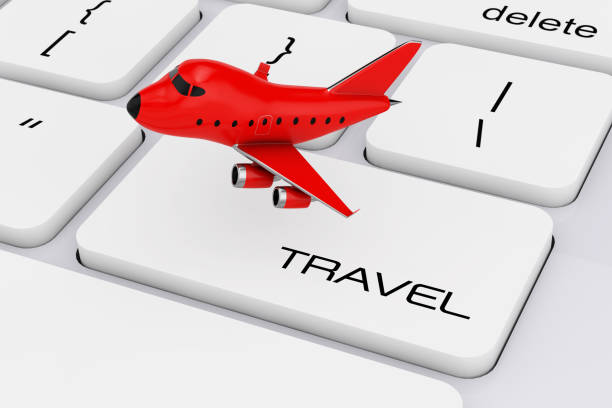 istock Red Cartoon Toy Jet Airplane over Computer Keyboard with Travel Sign. 3d Rendering 689599768