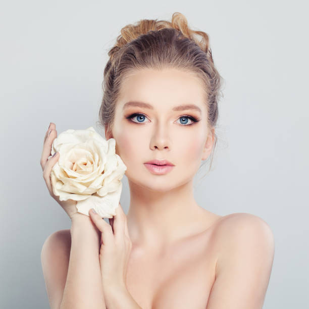 istock Young Woman with White Rose. Spa Model 689609332