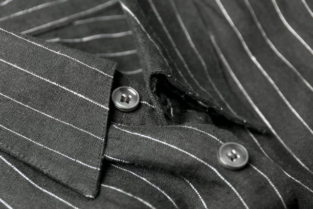 istock Close up view of a generic black business shirt with a line pattern 689609598