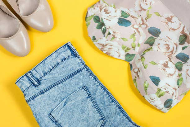 istock Summer feminine clothes on bright yellow background 689610088