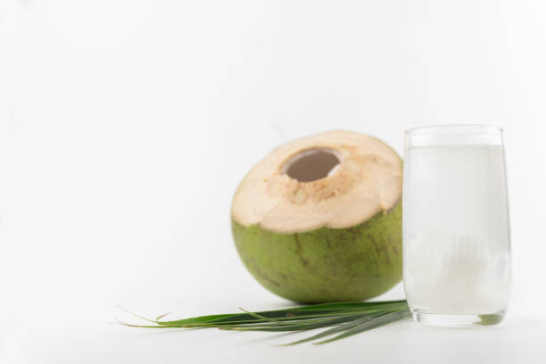 istock Fresh coconut drink with young coconut on white background 689621974