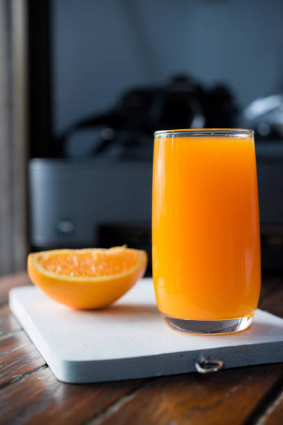 istock Freshly squeezed orange juice,orange juice on desk 689622734