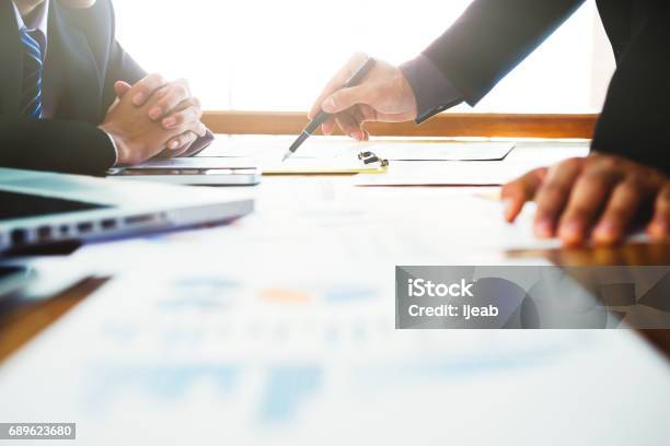 Startups Businessmen Teamwork Brainstorming Meeting To Discuss Plan Startup Project Stock Photo - Download Image Now