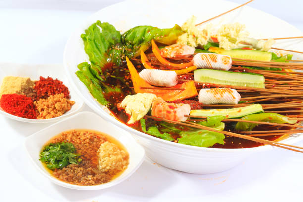 Beef string Chicken wings string winter melon string seafood lettuce red hot soup in white porcelain bowl
