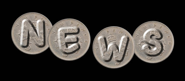 istock NEWS – Coins on black background 689633218