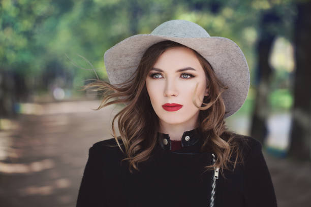 Beautiful woman with a beautiful smile and hat enjoy life