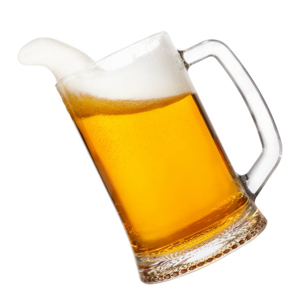 istock beer in mug with splashing foam 689650294