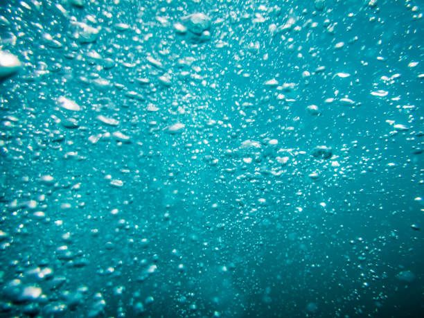 istock Water texture. Bubbles in underwater, in blue ocean. 689651532