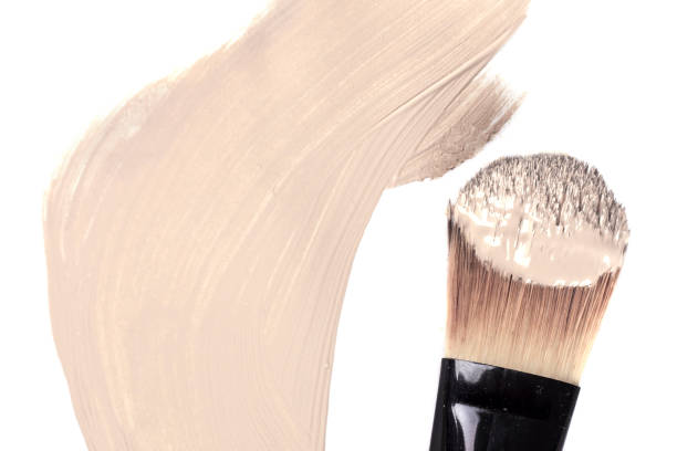 istock Cosmetic liquid foundation and professional brush isolated on white 689659844