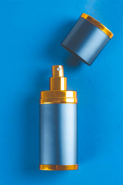 istock Bottle of man perfume on blue background with copy space 689663502