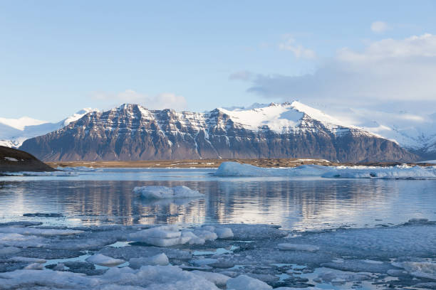 istock Volcano rock mountain over winter lagoon, Iceland 689671042