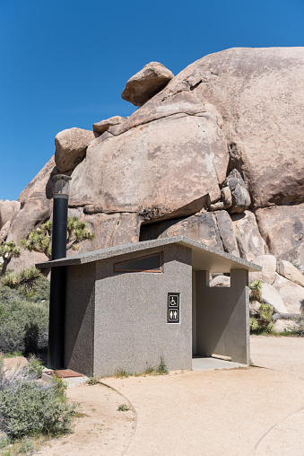 Handicapped Privy in Desert near climbing rocks