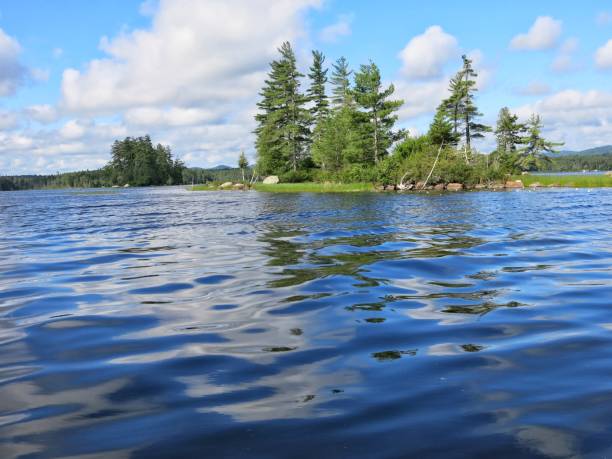 istock Racquette Lake Blue Rippled Water, Tree Lined Island, NY Adirondacks 689673554