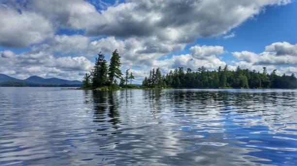 istock Racquette Lake Blue Rippled Water, Tree Lined Island, NY Adirondacks 689674708