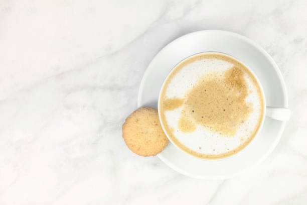 istock Cup of coffee with milk and butter cookie 689684616