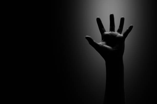 istock asking a helping hand in the dark with light, white tone 689684876