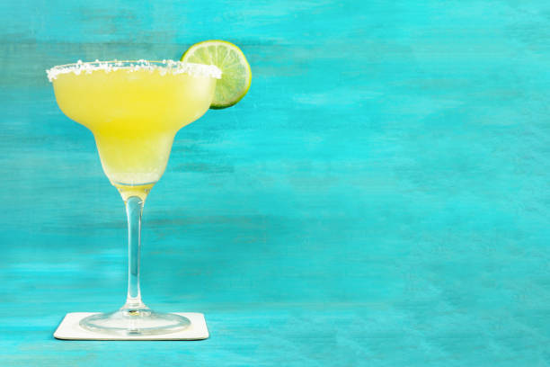 istock Lemon Margarita cocktail on vibrant turquoise with copyspace 689687994