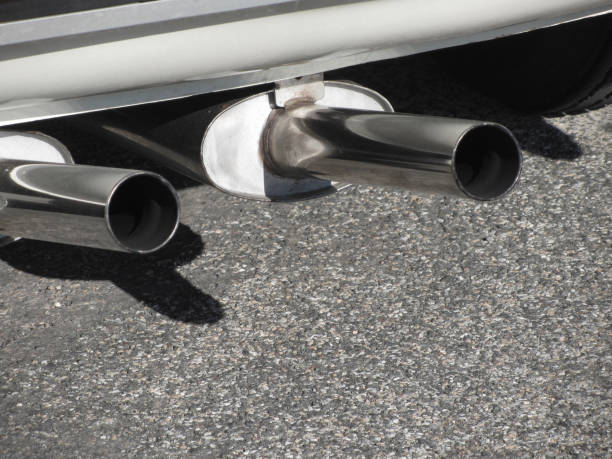 istock Closeup of a classic car exhaust pipe . Double pipe . Pollution concept 689705186