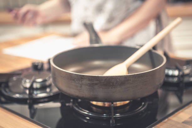 istock Frying pan on gas stove in the kitchen. 689716282