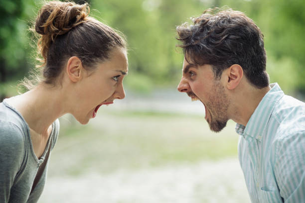 istock Couple breaking up and shout at each other 689716576