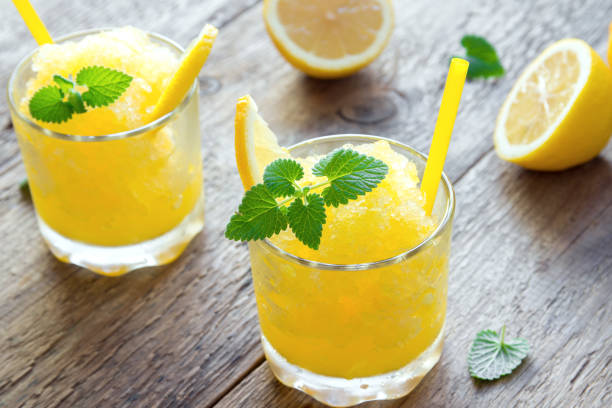 lemon slush drink - cocktail orange cup juice imagens e fotografias de stock