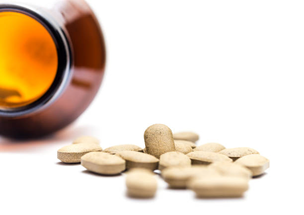 istock Medicine spilling out of a bottle isolated 689725456