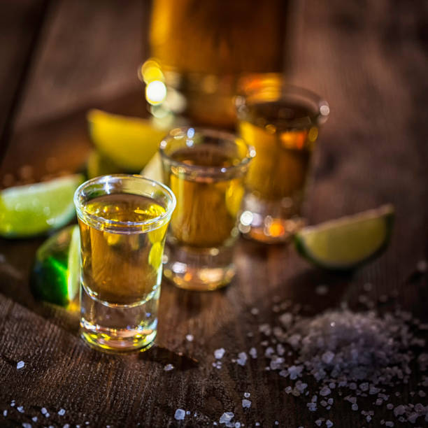 tequila shots with salt and lime - shot glass imagens e fotografias de stock