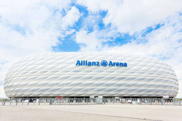 Allianz Arena in Munich Soccer stadium Allianz Arena in Munich, Germany. The stadium has a 75,000 seating capacity. Widely known for its exterior of inflated ETFE plastic panels, it is the first stadium in the world with a full colour changing exterior. It is the second largest arena in Germany behind only Signal Iduna Park in Dortmund and home to FC Bayern Munich and TSV 1860 Munchen. allianz arena stock pictures, royalty-free photos & images