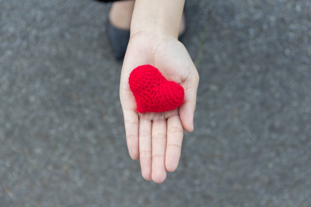 istock Red heart on hand,gift valentine concept 689734766