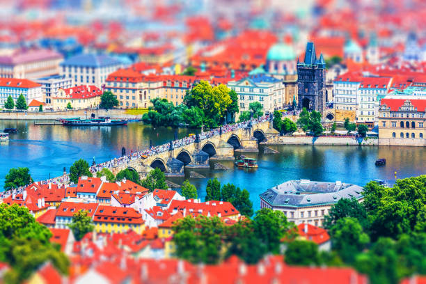 Scenic summer aerial panorama of the Old Town pier architecture with Charles Bridge and Vltava river in Prague, Czech Republic with tilt shift miniature effect