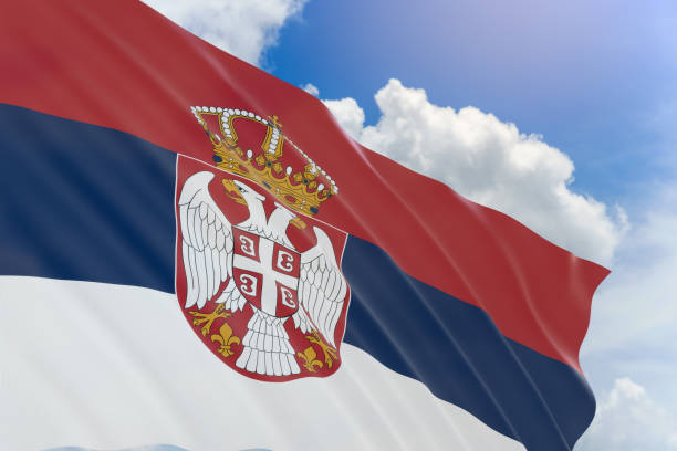 istock 3D rendering of Serbia flag waving on blue sky background 689737696
