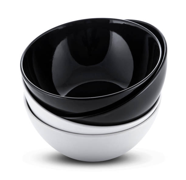 istock Stack of white and black bowls or plates isolated on white background 689740072