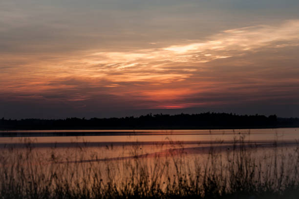 istock Beautiful stormy sunset. Fiery orange sunset sky. 689742702