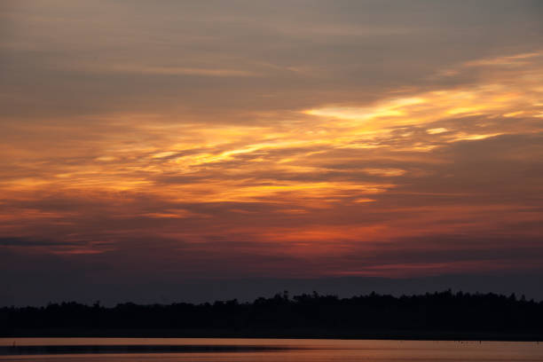istock Beautiful stormy sunset. Fiery orange sunset sky. 689742756