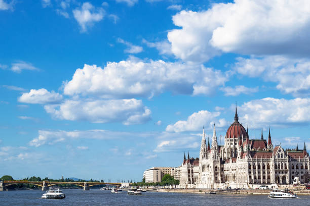 Parliament Building Budapest, Hungary Parliament Building and View of Danube River with Clouds, Budapest, Hungary danube river stock pictures, royalty-free photos & images