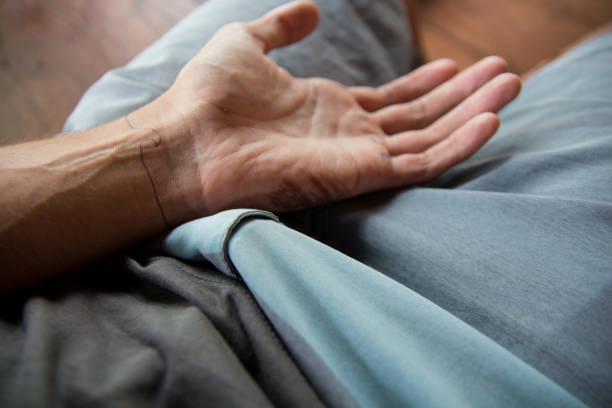 istock Human hand with wave tattoo in the lap 689746142